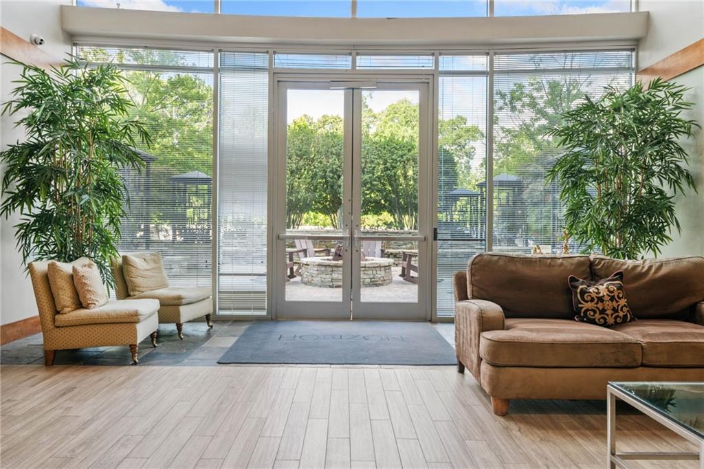 3300 Windy Ridge Parkway Southeast, Unit 1113 Atlanta, GA 30339 - Photo 33 of 39 a living room with furniture and a large window