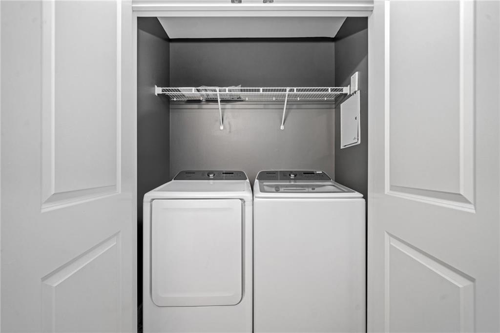 3300 Windy Ridge Parkway Southeast, Unit 1113 Atlanta, GA 30339 - Photo 6 of 39 a utility room with dryer and washer