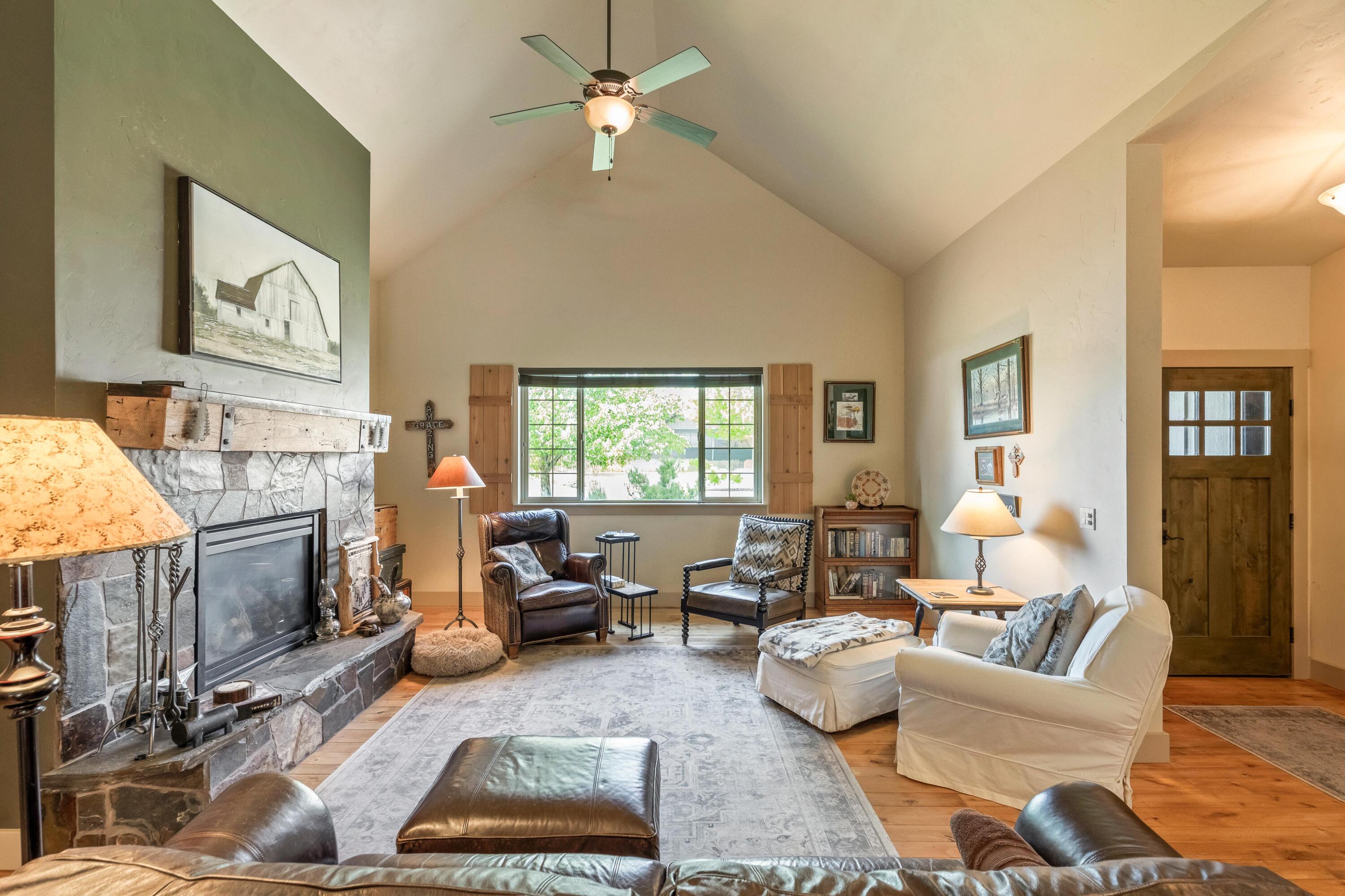 210 Northwest Saddle Ridge Loop Prineville, OR 97754 - Photo 6 of 38 a living room with furniture fireplace and a window