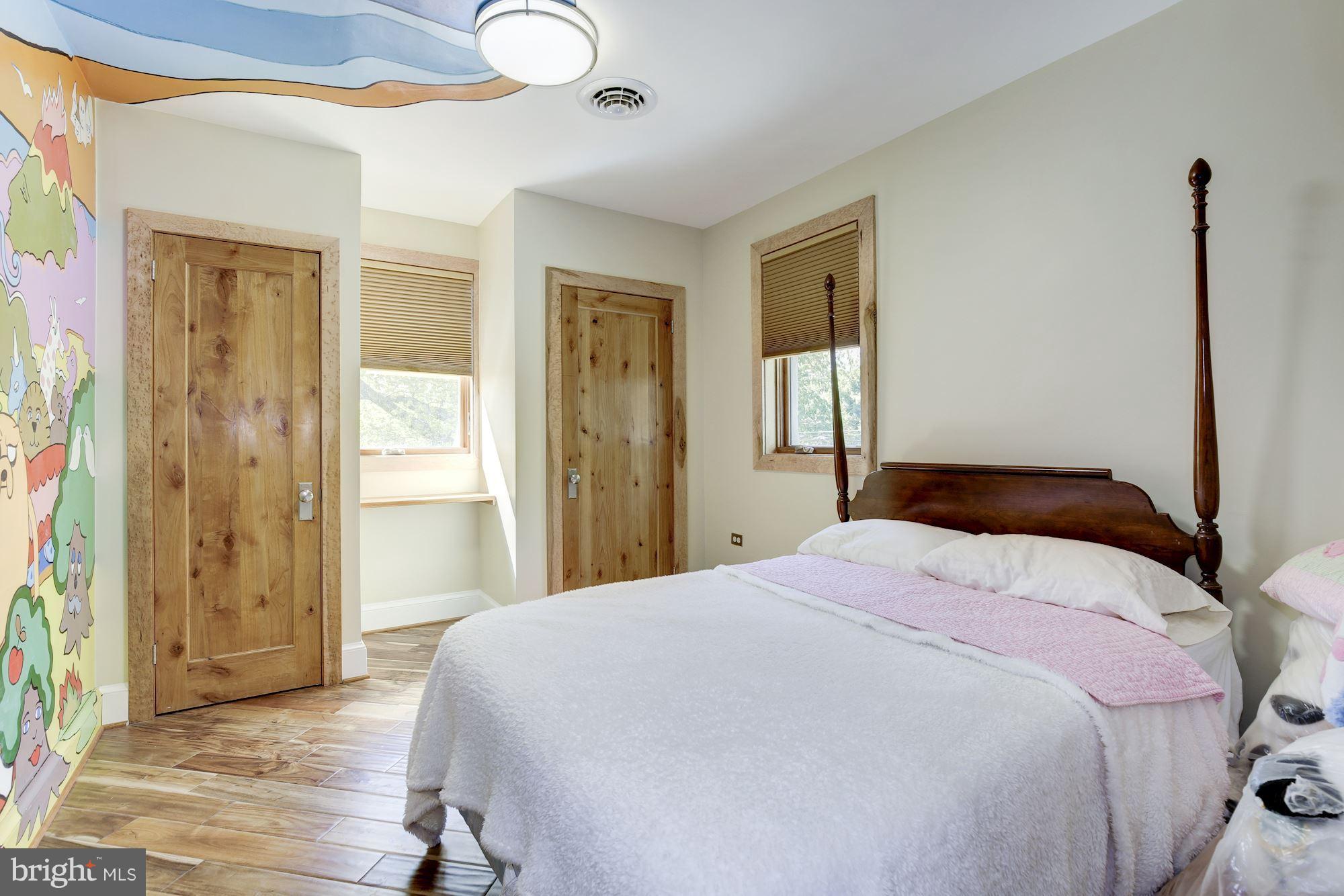 4949 Allan Road Bethesda, MD 20816 - Photo 11 of 27 a bedroom with a bed and a mirror