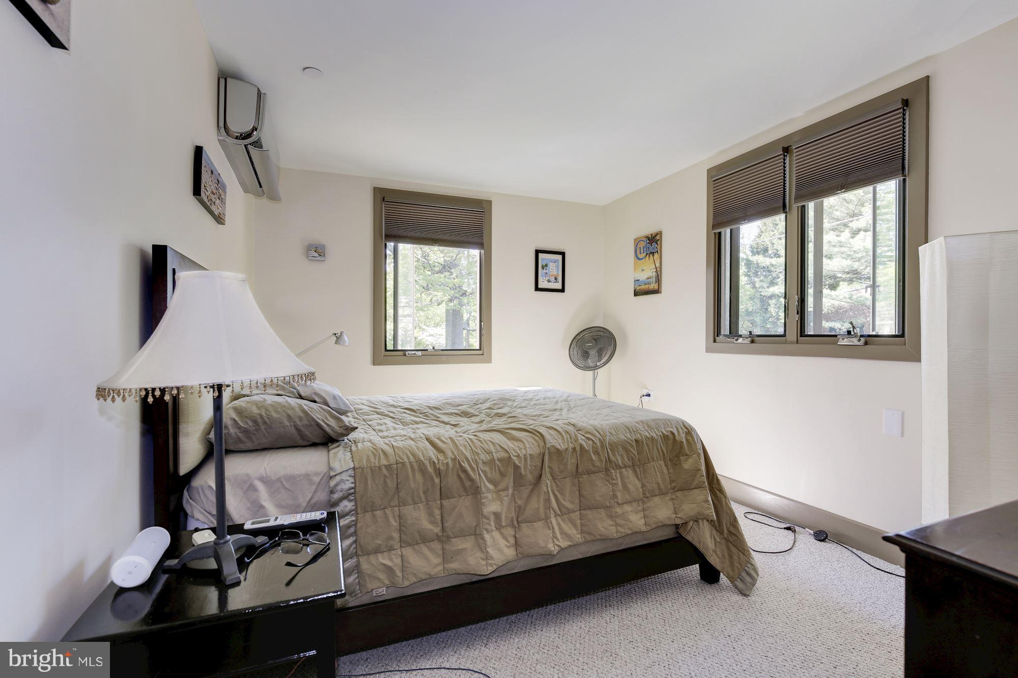 4949 Allan Road Bethesda, MD 20816 - Photo 18 of 27 a bedroom with a bed and window