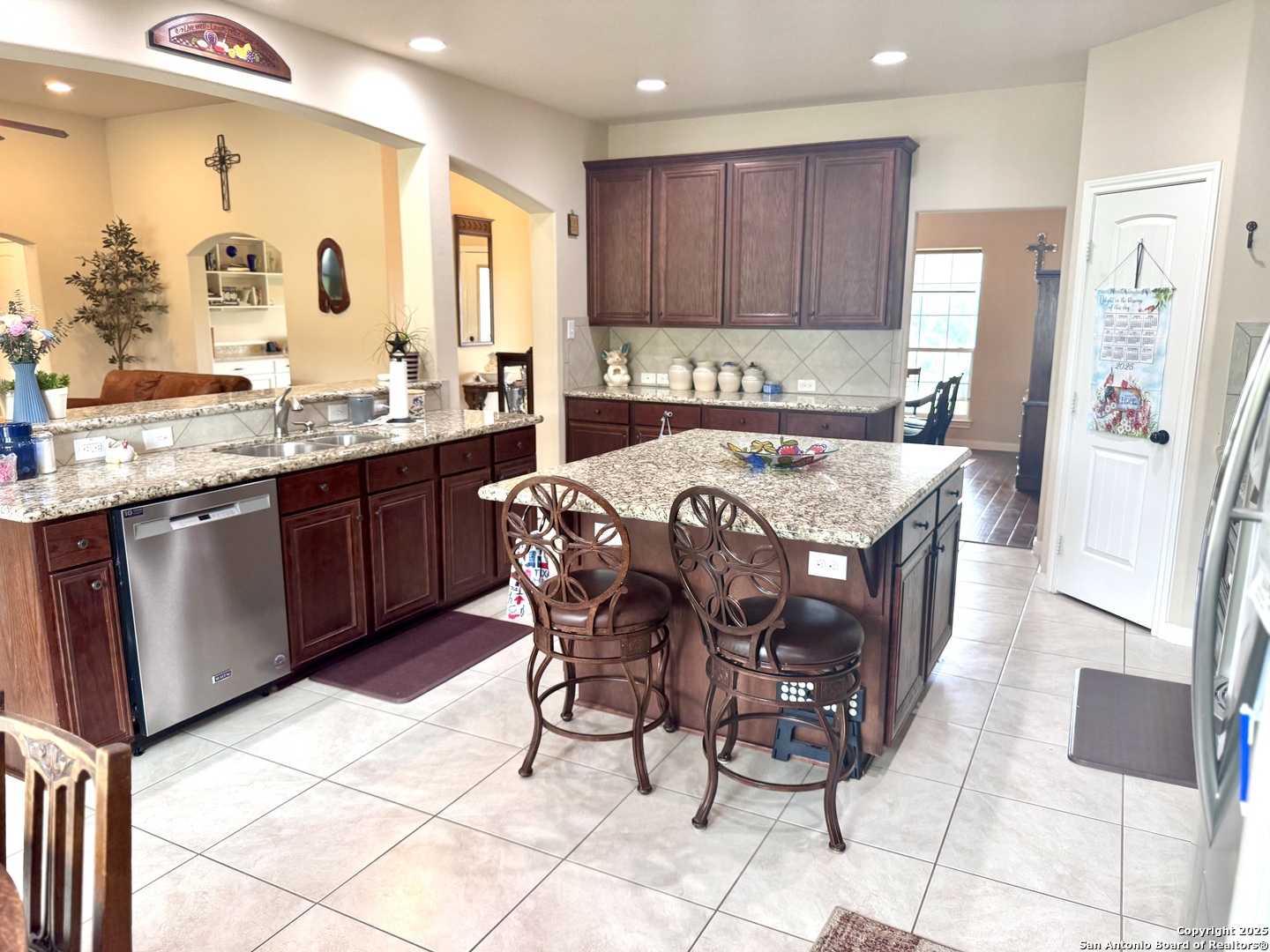 187 Tracks Center Point, TX 78010 - Photo 11 of 42 a large kitchen with granite countertop a stove a sink and a refrigerator