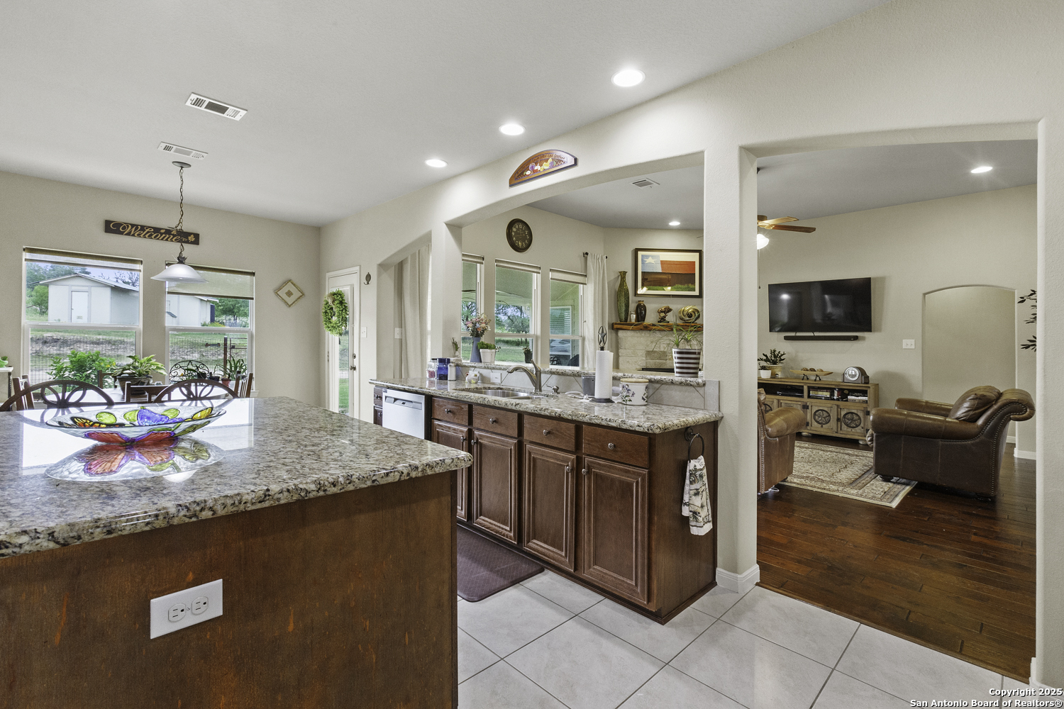 187 Tracks Center Point, TX 78010 - Photo 13 of 42 a kitchen with granite countertop a sink and stove