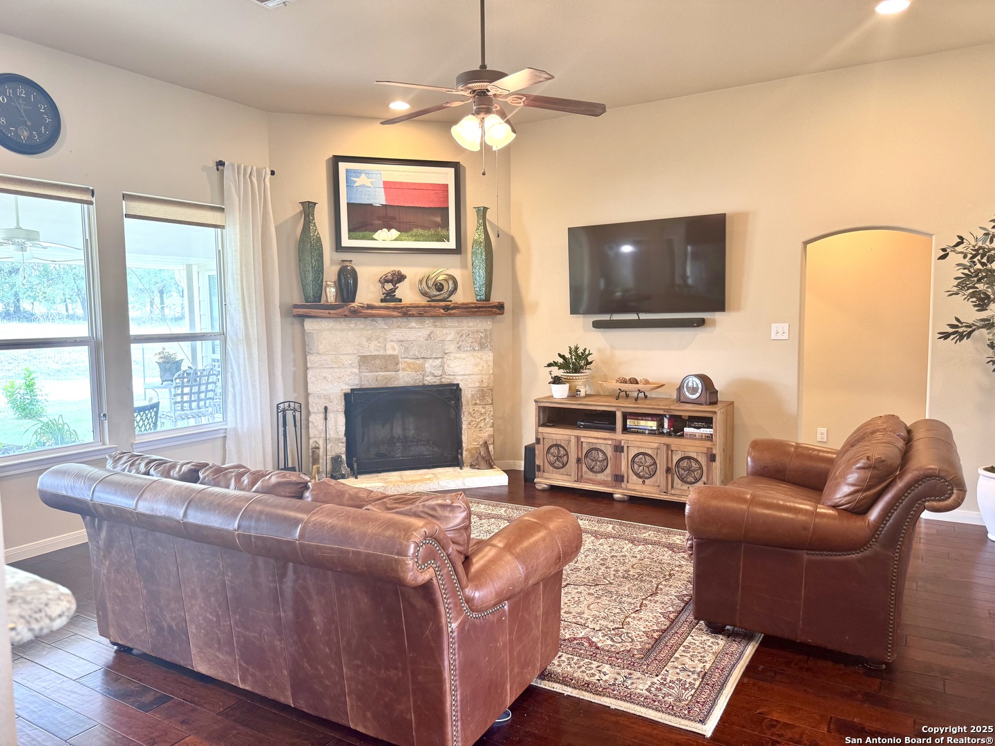 187 Tracks Center Point, TX 78010 - Photo 18 of 42 a living room with furniture a flat screen tv and a fireplace