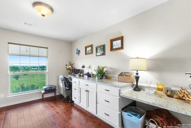 a workspace with furniture and window