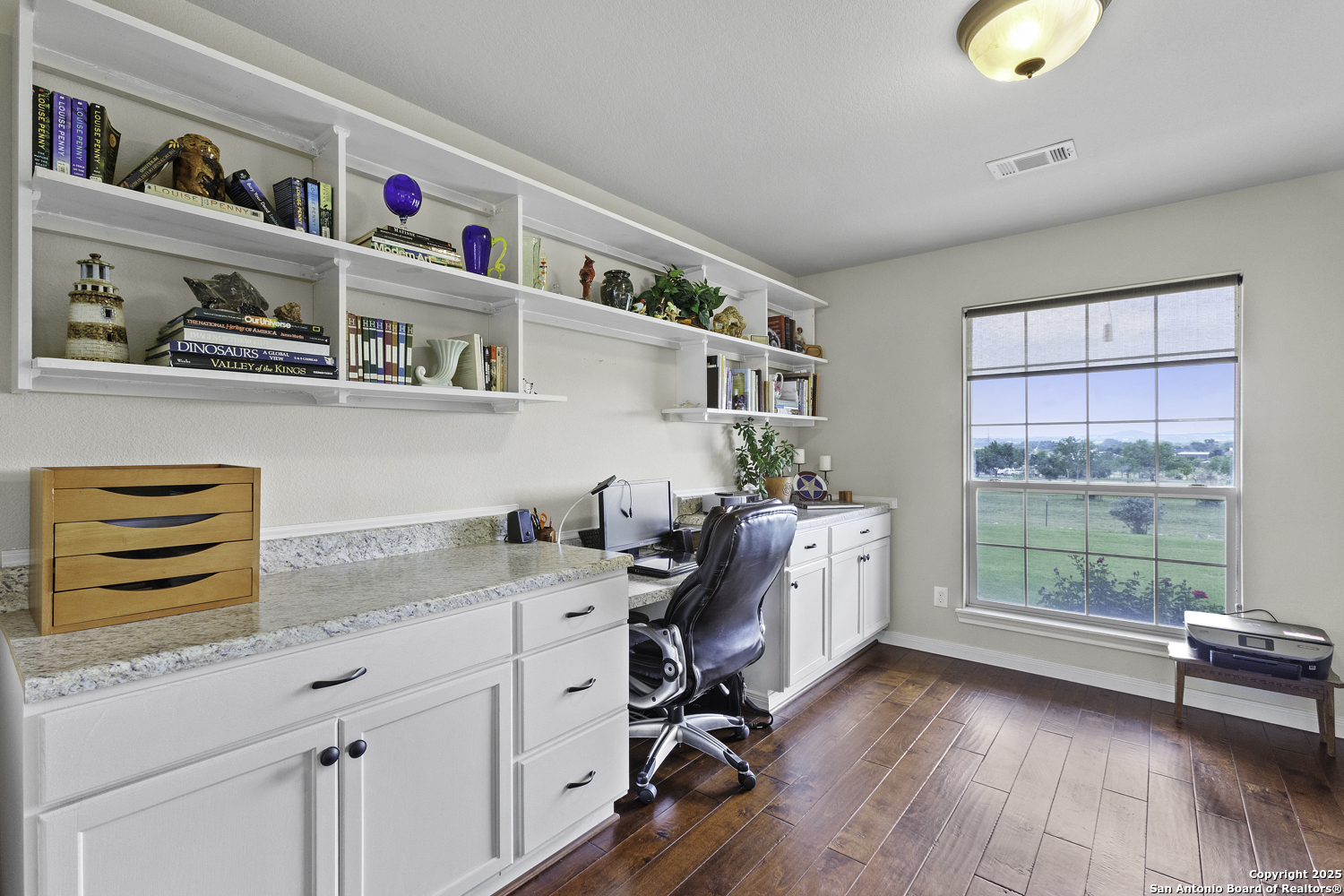 187 Tracks Center Point, TX 78010 - Photo 21 of 42 a view of workspace with wooden floor and a window