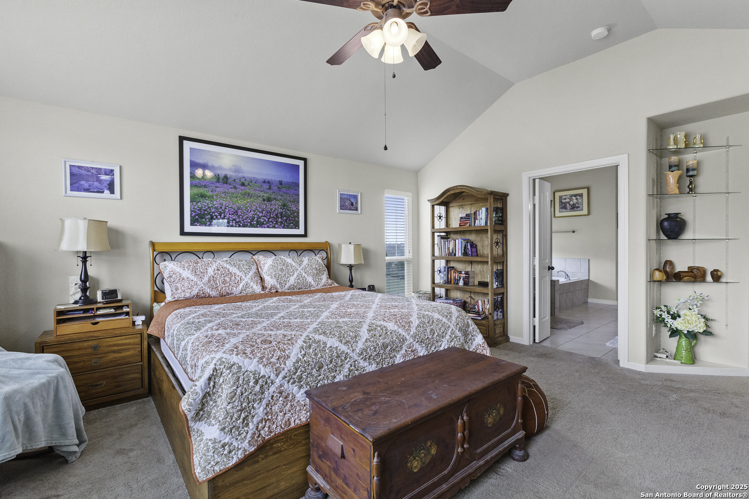 187 Tracks Center Point, TX 78010 - Photo 29 of 42 a bedroom with a bed and a chandelier