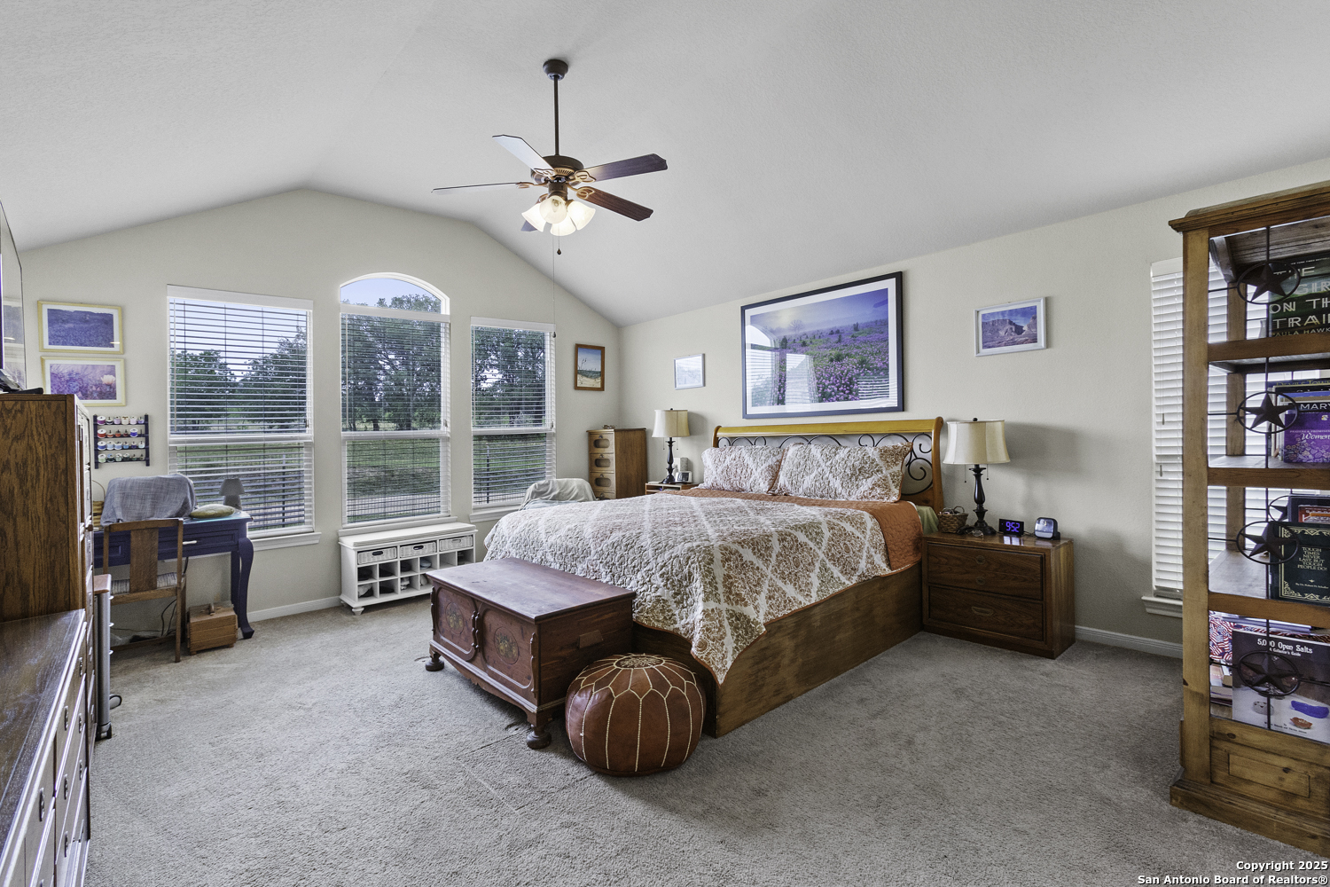187 Tracks Center Point, TX 78010 - Photo 30 of 42 a spacious bedroom with a bed and a chandelier
