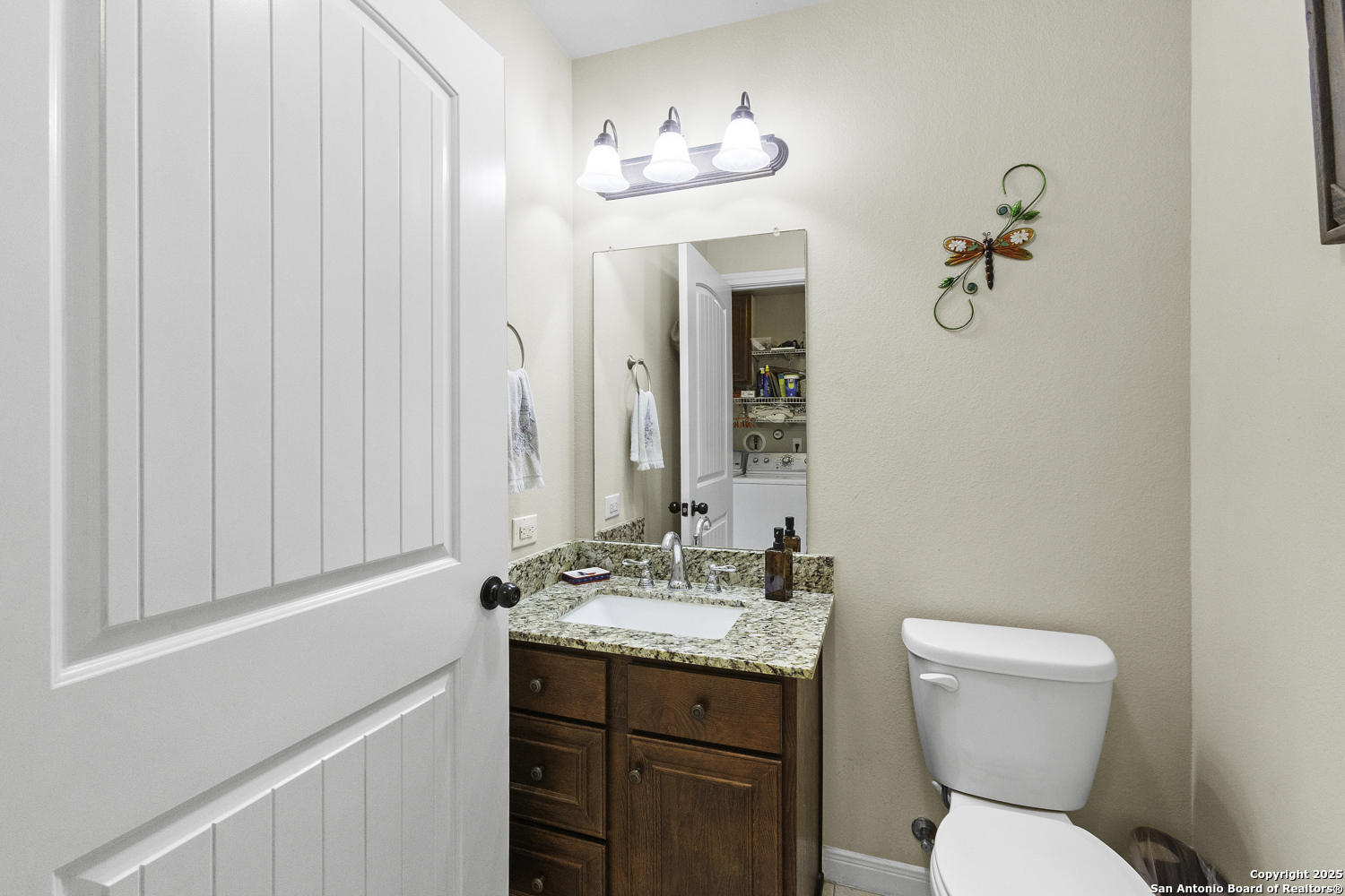 187 Tracks Center Point, TX 78010 - Photo 36 of 42 a bathroom with a toilet a sink and mirror