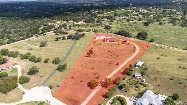 a view of a swimming pool with a yard