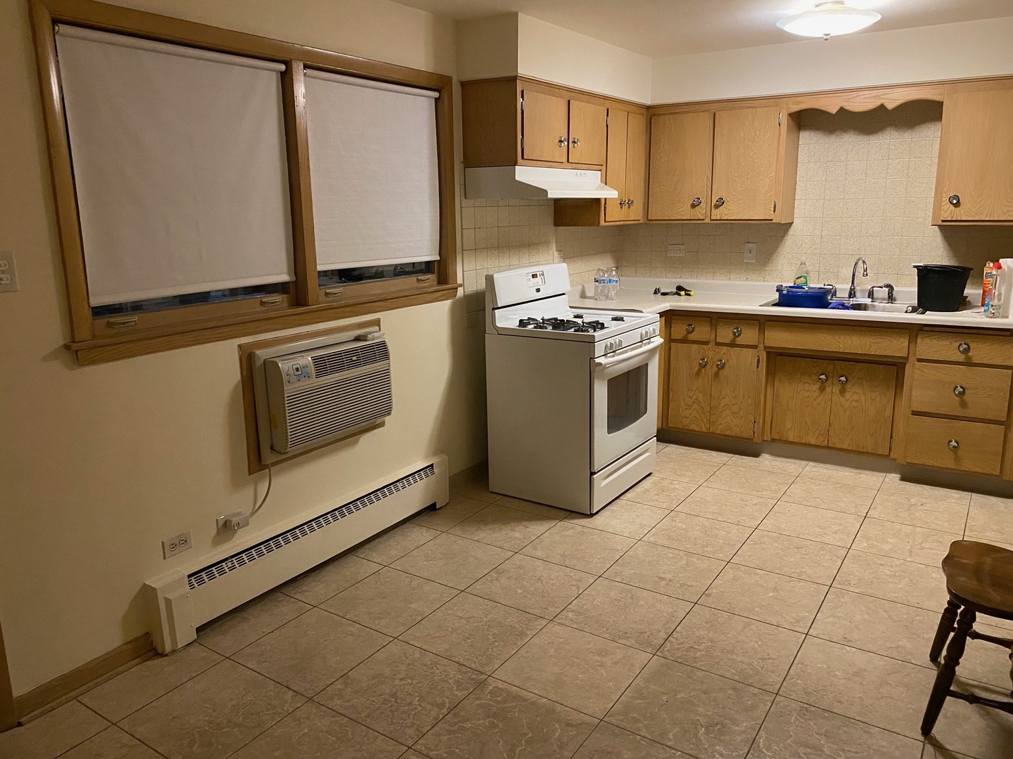 5930 North Odell Avenue, Unit GB Chicago, IL 60631 - Photo 2 of 6 a kitchen with a stove cabinets and a refrigerator