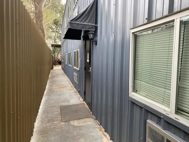 a view of a porch with wooden floor and stairs