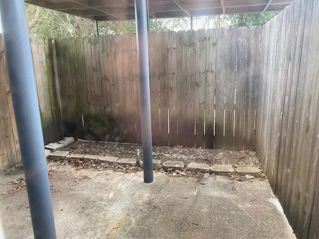 a view of a door with a wooden fence