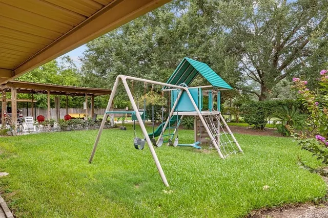 a view of a yard with a slide