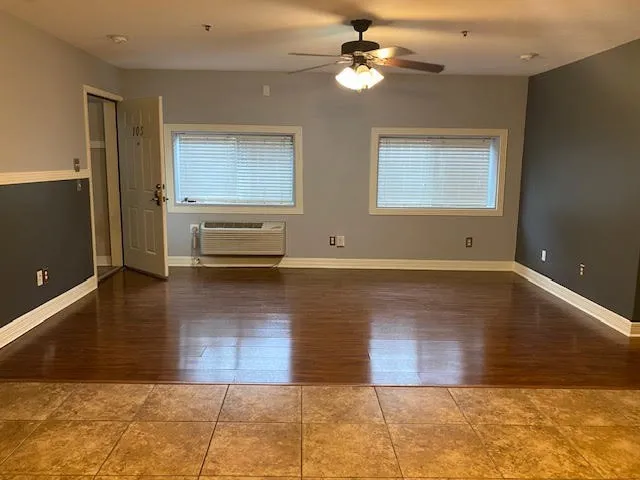 a view of livingroom with hardwood floor and a ceiling fan
