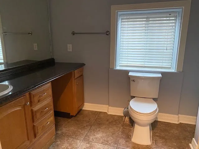 a bathroom with a toilet and a sink