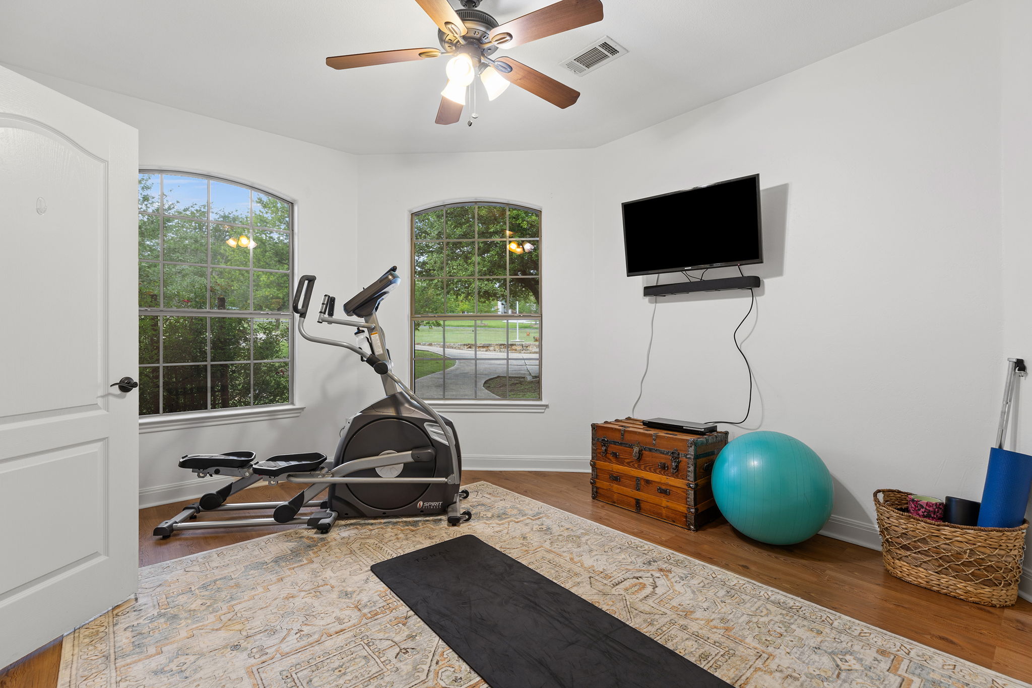 17308 St Therese Road Manor, TX 78653 - Photo 23 of 40 a living room with furniture a flat screen tv and a window
