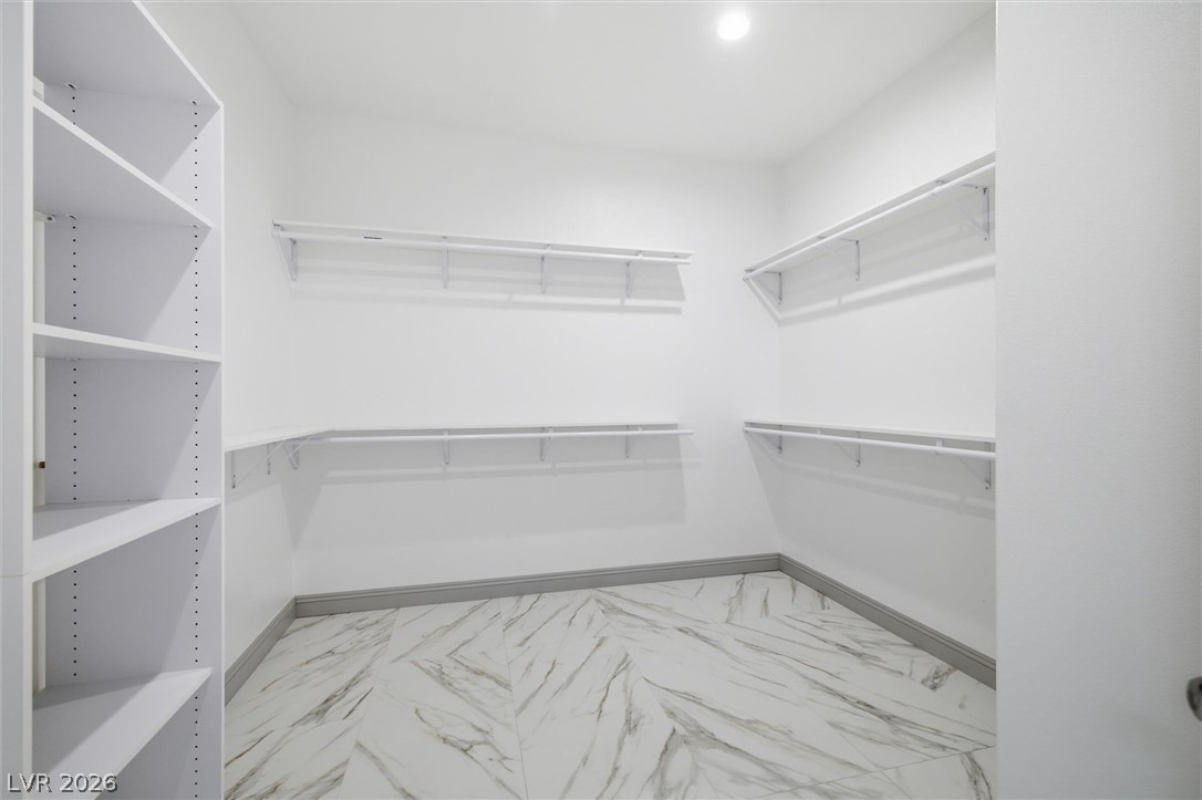 1061 Factory Road Pahrump, NV 89048 - Photo 28 of 41 Ample shelving and hanging space defines this generously sized, well-appointed closet, ready for personalized organization.