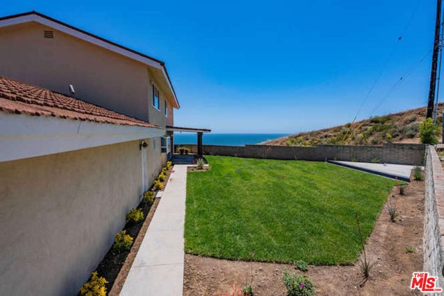a view of a backyard with golf course