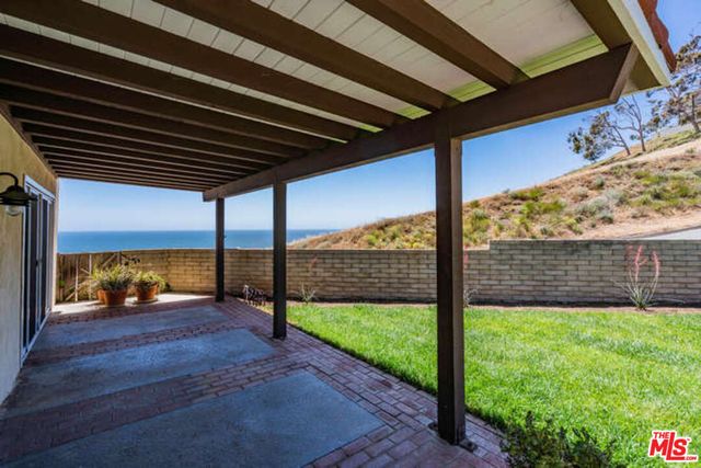 a view of porch with a backyard