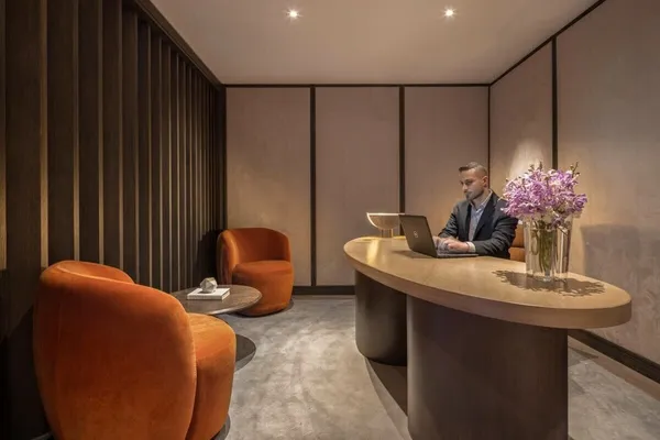 a dining room with furniture and flowers