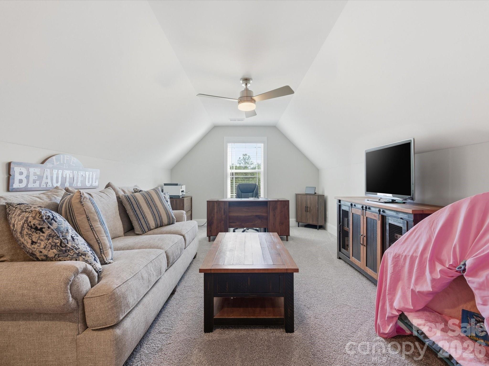 4166 Persimmon Road Lancaster, SC 29720 - Photo 29 of 41 a living room with furniture and a flat screen tv