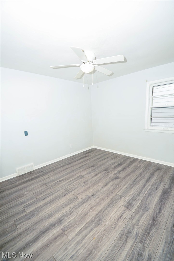 24599 Chardon Road Cleveland, OH 44143 - Photo 17 of 28 Unfurnished room with dark wood-type flooring and ceiling fan