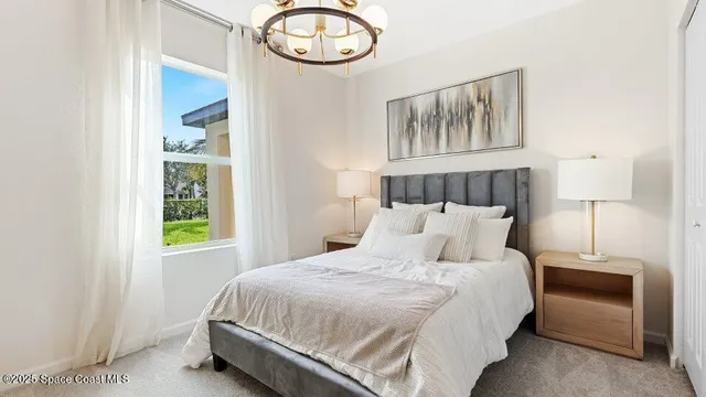 a bedroom with a bed and window