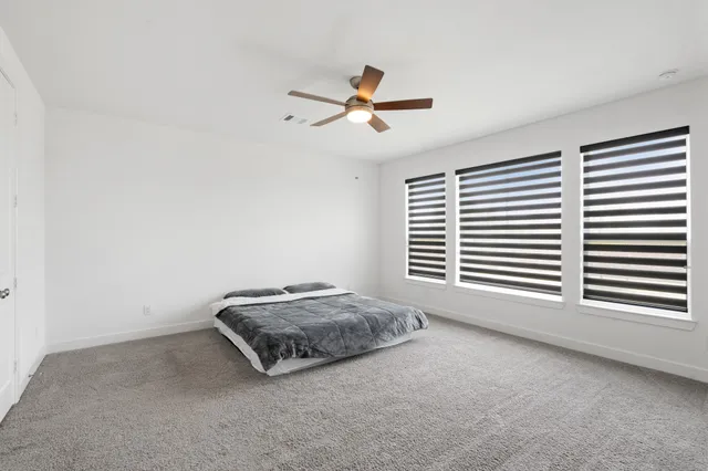 a room with a bed and a window