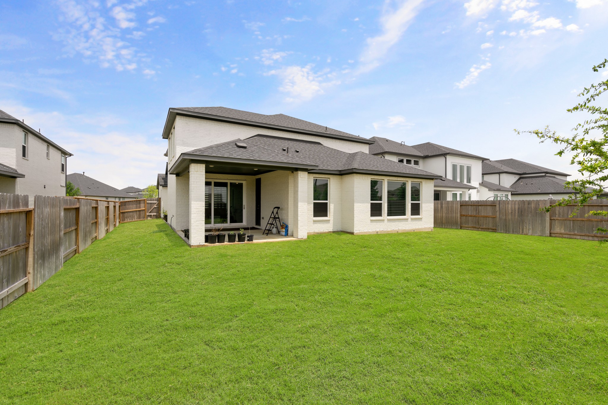 6311 Winthrop Terrace Trail Katy, TX 77493 - Photo 35 of 40 Back exterior with a view of covered patio.