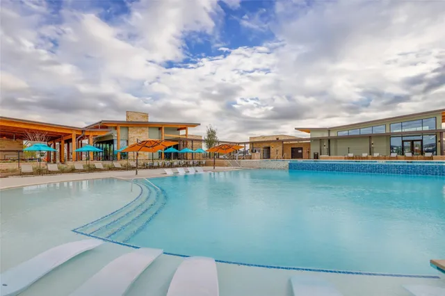 a view of swimming pool from a balcony
