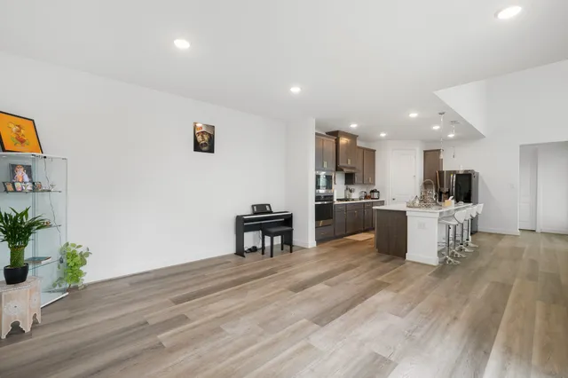a view of kitchen with table and chairs