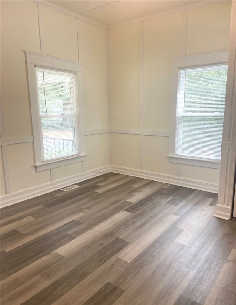 208 Hampton Street Iva, SC 29655 - Photo 8 of 19 This bright space features sleek flooring and ample natural light, creating an inviting atmosphere.