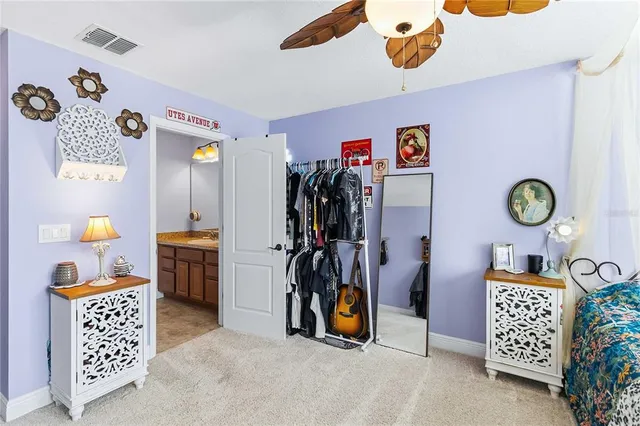 a bedroom with a bed a dresser and a window