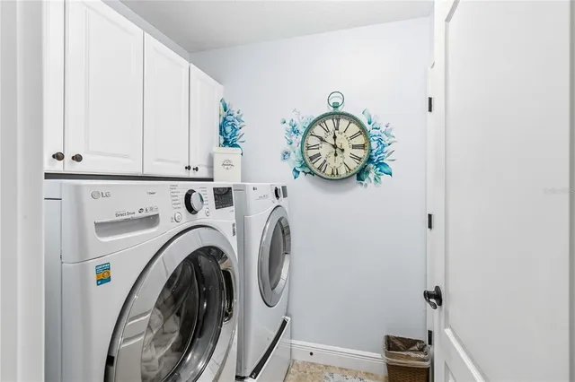 a view of a room with furniture and floor to ceiling window