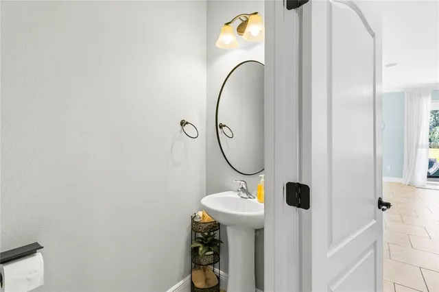 a view of a swimming pool with a patio and a tub