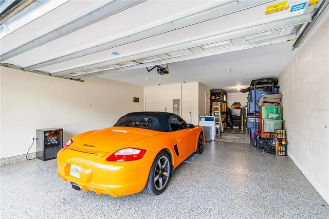 a view of a swimming pool with a couches and chairs