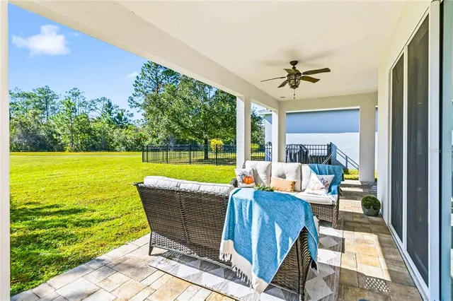 a view of swimming pool with outdoor seating
