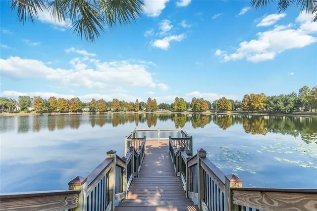 a view of a lake with houses in the back
