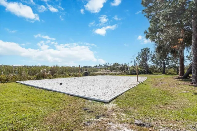 a view of an house with garden space and sitting area