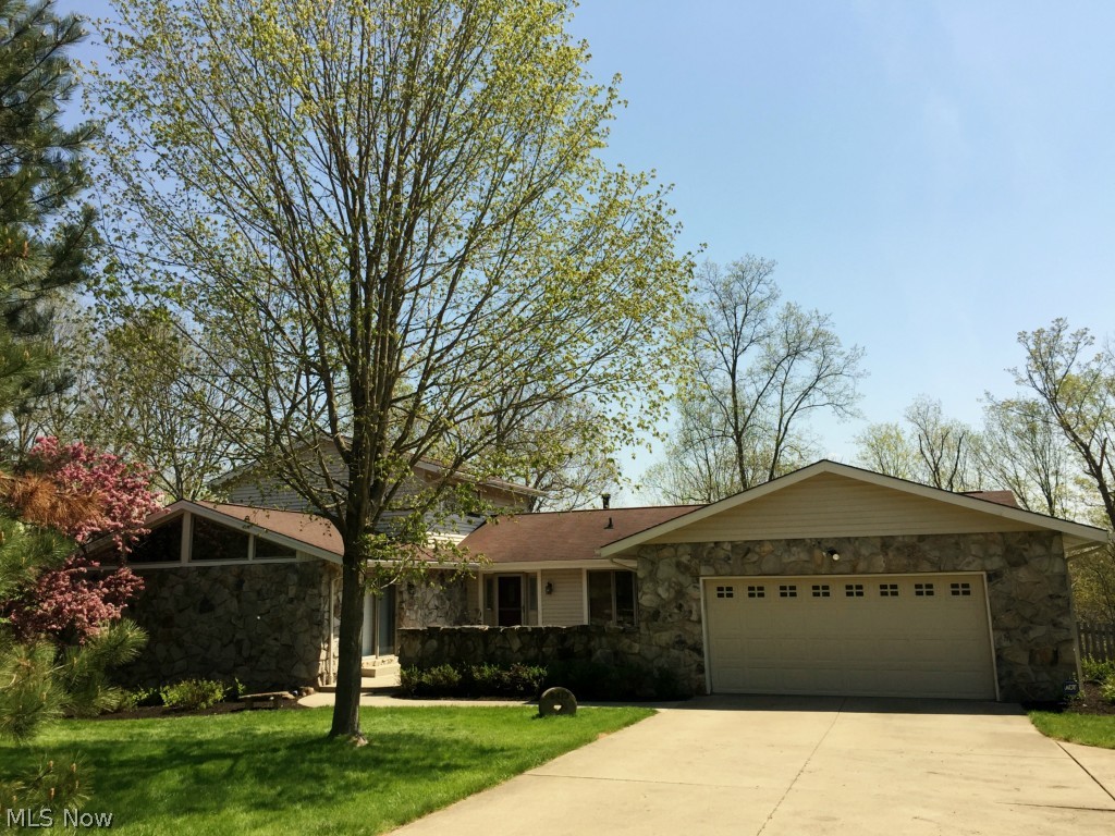 6413 Riverview Road Peninsula, OH 44264 - Photo 21 of 24 Welcome Home, to 6413 Riverview Road where paradise meets home sweet home with stone and vinyl exterior and an inviting courtyard