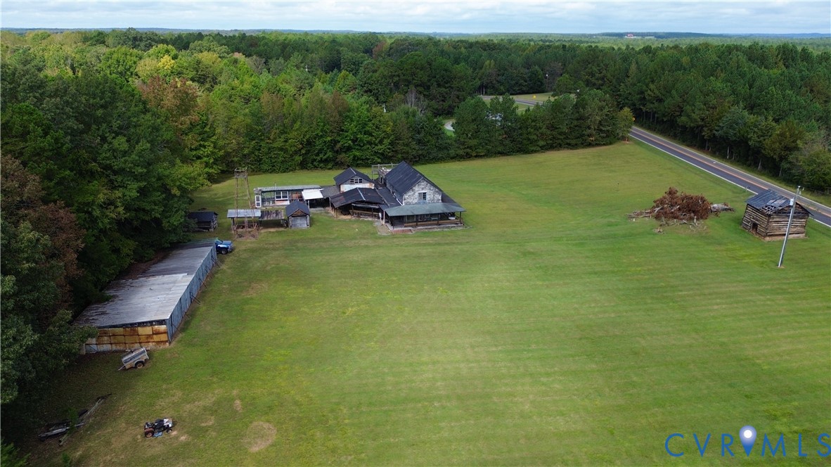 7246 MacDonald Road Scottsburg, VA 24589 - Photo 12 of 46 a view of a garden with lawn chairs