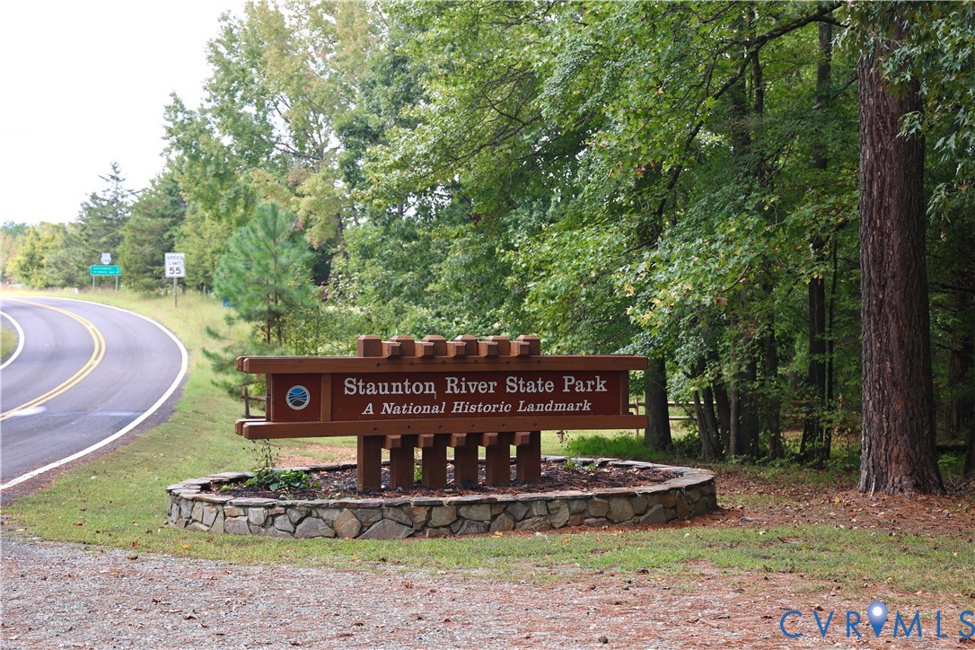 7246 MacDonald Road Scottsburg, VA 24589 - Photo 14 of 46 a wooden bench sitting in the middle of a park