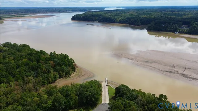 a bedroom with a bed and a table chair