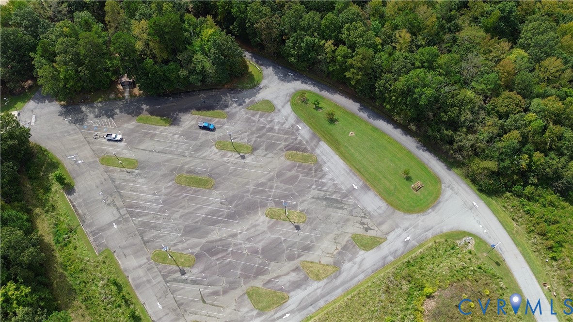 7246 MacDonald Road Scottsburg, VA 24589 - Photo 16 of 46 a view of a backyard with plants