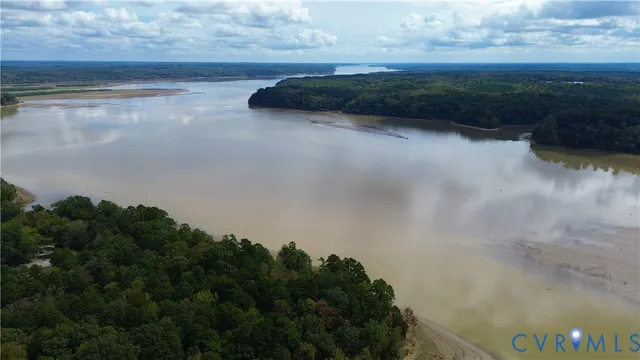 a bathroom with a toilet and a shower curtain