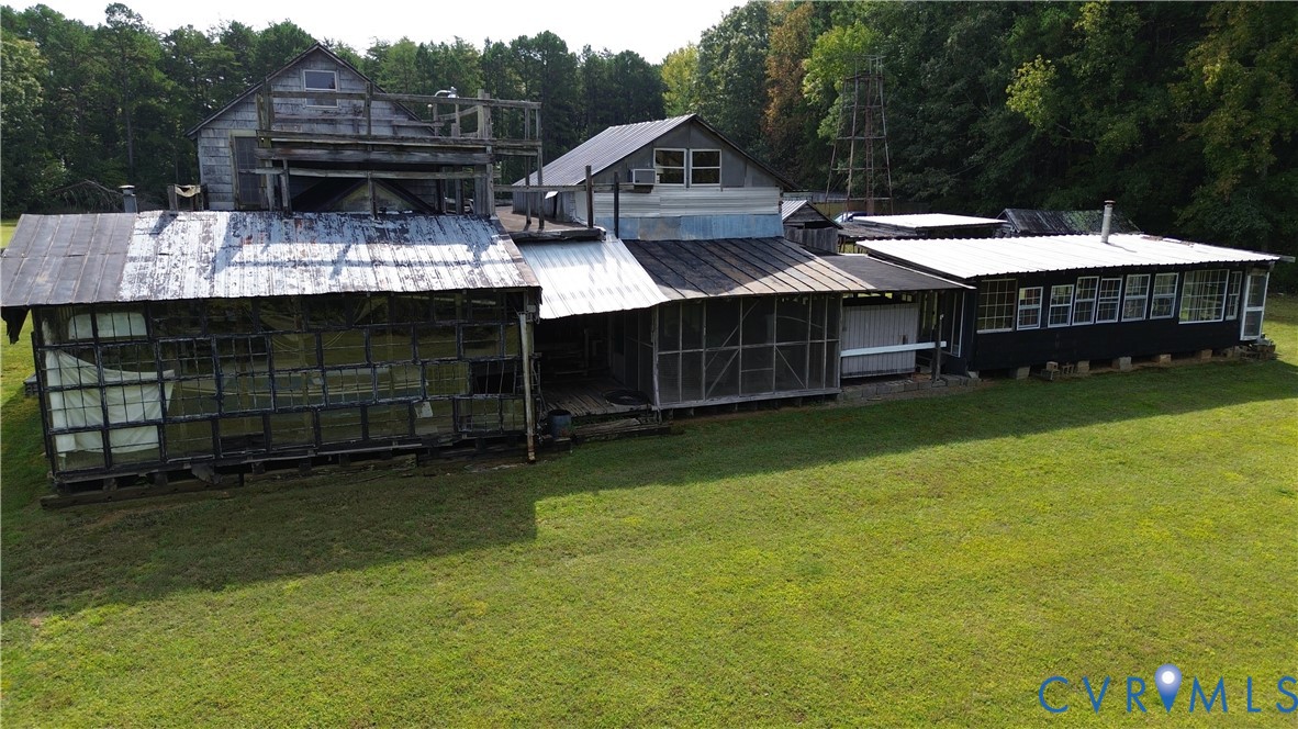 7246 MacDonald Road Scottsburg, VA 24589 - Photo 24 of 46 a aerial view of a house with a garden and deck