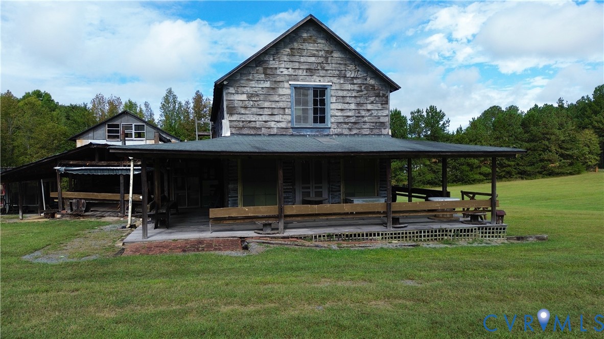7246 MacDonald Road Scottsburg, VA 24589 - Photo 25 of 46 a view of a house with backyard and sitting area