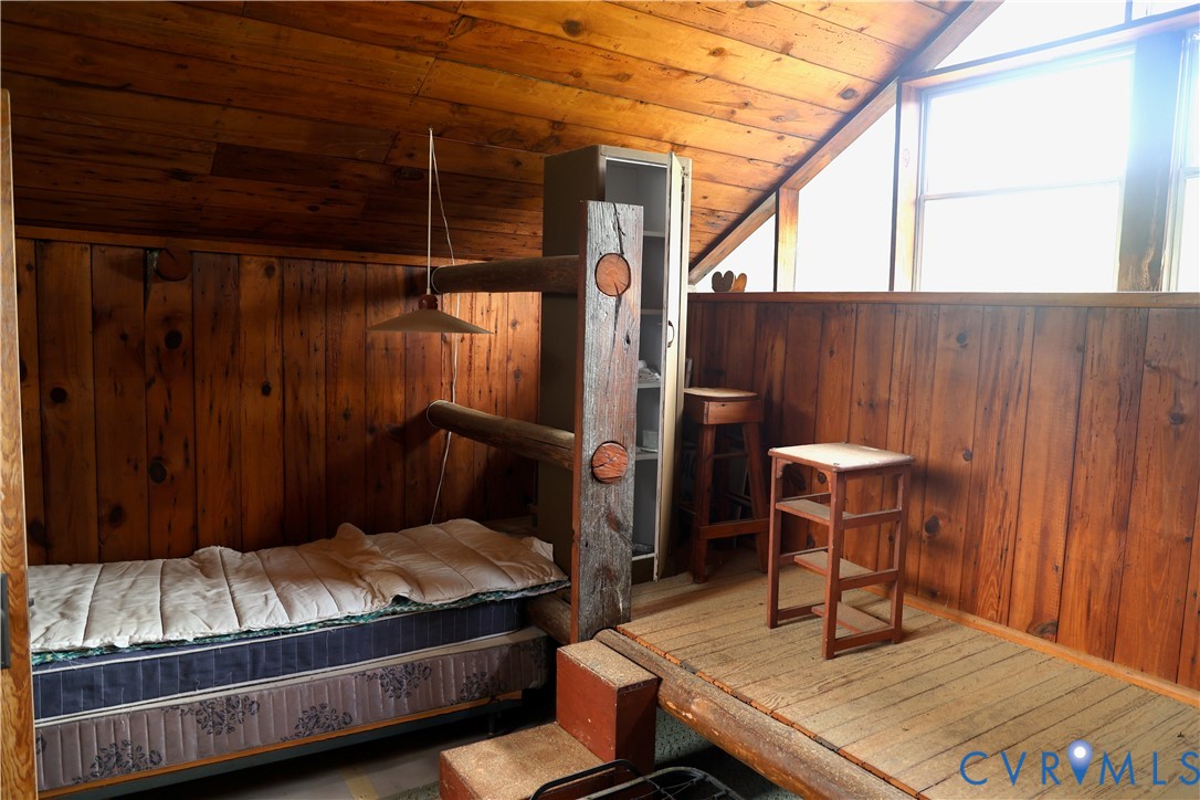 7246 MacDonald Road Scottsburg, VA 24589 - Photo 33 of 46 a bedroom with a bed and a table chair