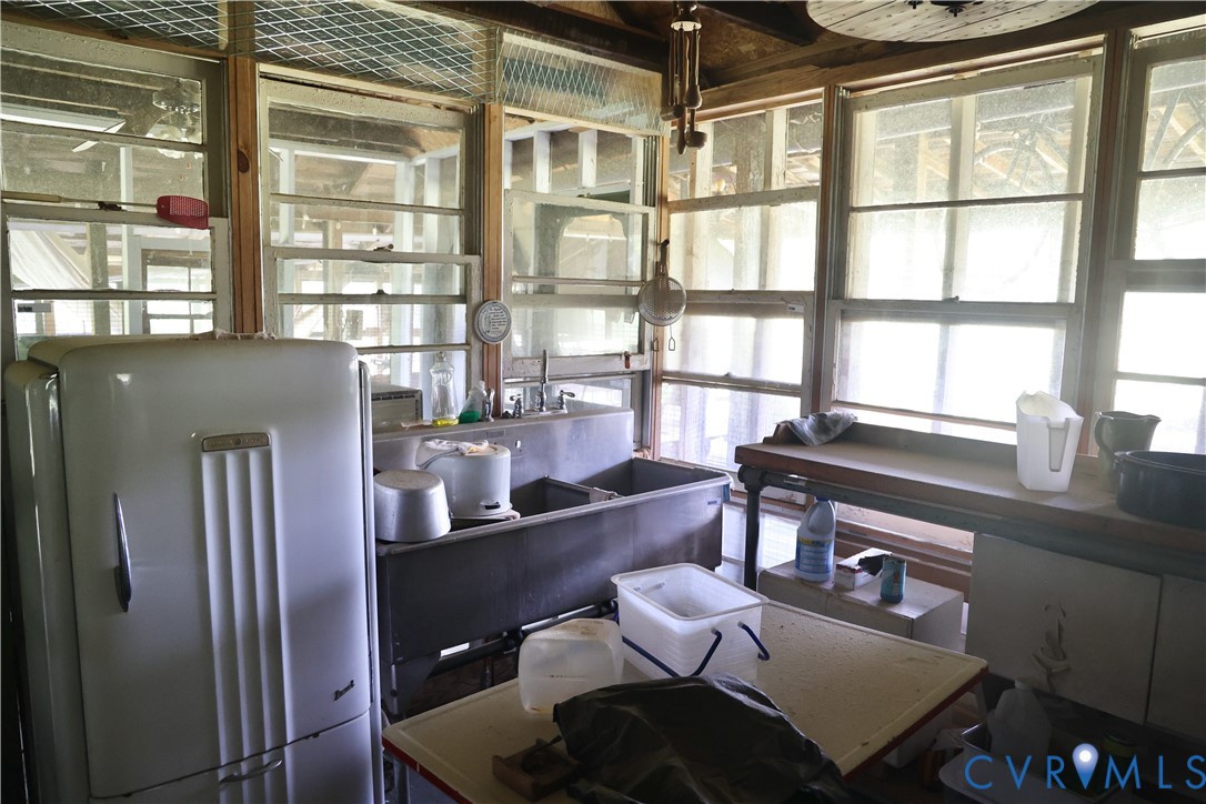 7246 MacDonald Road Scottsburg, VA 24589 - Photo 34 of 46 a dining room with furniture and a window